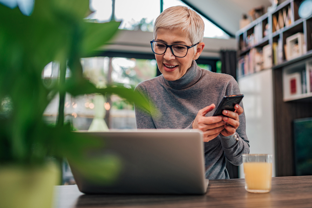 woman uses technology to contact and find out more