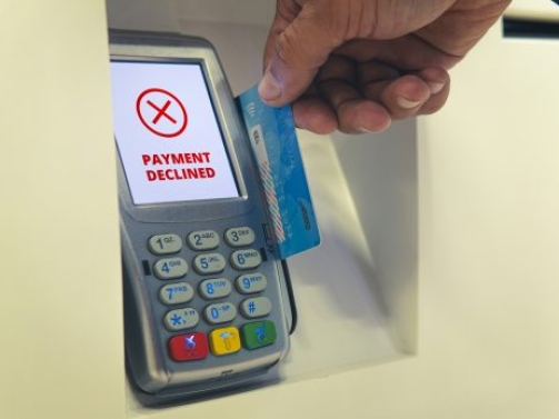 Credit card swiping failed. The payment was rejected. Payment by card at the terminal. I ran out of money on my credit card. The debit card bank account is blocked. Concept.